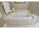 A close-up view of a bathtub with gold fixtures at 102 Rosewood Ln, Locust, NC 28097