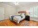 Bedroom with hardwood floors, shutters, and a ceiling fan at 102 Rosewood Ln, Locust, NC 28097