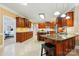 Well-appointed kitchen with extensive cabinetry, granite countertops, an island with seating, and stainless steel appliances at 102 Rosewood Ln, Locust, NC 28097