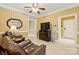 Cozy living room with crown molding, tile floors, and neutral tones at 102 Rosewood Ln, Locust, NC 28097
