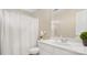 Bright bathroom with a shower, large vanity, and decorative mirror and plant at 10306 Madison Park Dr, Charlotte, NC 28269