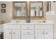 Elegant bathroom featuring a double vanity, and beautifully framed mirrors at 10306 Madison Park Dr, Charlotte, NC 28269