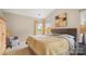 Comfortable bedroom with a cozy bed, light colored walls, and bright windows at 10306 Madison Park Dr, Charlotte, NC 28269