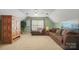 Spacious bonus room with ample seating, neutral carpet, and a cozy ambiance at 10306 Madison Park Dr, Charlotte, NC 28269