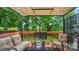 Outdoor deck featuring comfortable seating and serene views of the surrounding greenery at 10306 Madison Park Dr, Charlotte, NC 28269