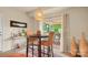 Bright dining area features modern lighting and a sliding glass door to outdoor deck at 10306 Madison Park Dr, Charlotte, NC 28269