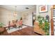 Stylish dining room features a glass table with unique tiger-striped chairs and modern light fixture at 10306 Madison Park Dr, Charlotte, NC 28269