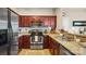 Functional kitchen featuring granite counters, stainless steel appliances, and ample cabinet space at 10306 Madison Park Dr, Charlotte, NC 28269