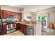 Well-equipped kitchen boasts stainless steel appliances, granite countertops, and an open layout at 10306 Madison Park Dr, Charlotte, NC 28269