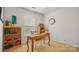 Home office featuring a desk, chair, bookshelf, and a bright window at 10306 Madison Park Dr, Charlotte, NC 28269