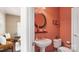 Stylish powder room with unique color scheme and elegant fixtures at 10306 Madison Park Dr, Charlotte, NC 28269