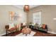 Cozy sitting room with plush seating, natural light, and unique decor at 10306 Madison Park Dr, Charlotte, NC 28269