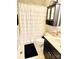 Traditional bathroom with a white shower curtain, black vanity, and decorative accents at 104 Laura Ct, Cherryville, NC 28021