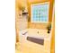 Relaxing soaking tub features a tile surround and a window at 104 Laura Ct, Cherryville, NC 28021