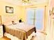 Cozy bedroom with a ceiling fan, window with sheer curtains, and a comfortable bed at 104 Laura Ct, Cherryville, NC 28021
