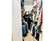 Walk-in closet featuring a RedHead safe, with hanging clothes and storage shelves at 104 Laura Ct, Cherryville, NC 28021