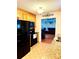 Bright kitchen showcasing tile floors, granite countertops, and stainless steel appliances at 104 Laura Ct, Cherryville, NC 28021