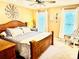 Comfortable main bedroom with a large bed, wood furnishings, and natural light at 104 Laura Ct, Cherryville, NC 28021