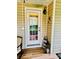 Covered porch with wood flooring, a decorative lantern, and inviting decor at 104 Laura Ct, Cherryville, NC 28021
