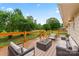 Staged back deck with outdoor seating and modern fire pit providing a cozy outdoor atmosphere at 105 Pelican Ct, Mooresville, NC 28117