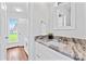 Bright bathroom with dual vanity and marble counter at 105 Pelican Ct, Mooresville, NC 28117