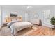 Comfortable bedroom with hard wood floors and neutral color tones at 105 Pelican Ct, Mooresville, NC 28117