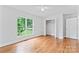 Bright bedroom with hardwood floors, two windows and neutral walls at 105 Pelican Ct, Mooresville, NC 28117