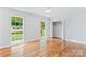 Bright bedroom with hardwood floors, two windows and neutral walls at 105 Pelican Ct, Mooresville, NC 28117
