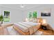 Modern bedroom with hardwood floors, neutral decor, and bright windows at 105 Pelican Ct, Mooresville, NC 28117