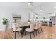 Spacious dining room with hardwood floors, elegant lighting, and easy access to kitchen at 105 Pelican Ct, Mooresville, NC 28117