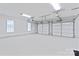 Spacious three-car garage with well-lit interiors and ample storage space at 105 Pelican Ct, Mooresville, NC 28117