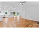 Open floor plan featuring hardwood floors and a seamless flow to the kitchen area at 105 Pelican Ct, Mooresville, NC 28117