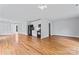 Expansive open concept living room and kitchen with hardwood floors and contemporary design at 105 Pelican Ct, Mooresville, NC 28117