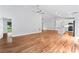 Open-concept living space with hardwood floors connecting the living, dining, and kitchen areas at 105 Pelican Ct, Mooresville, NC 28117