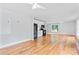 Open-concept kitchen and living area features hardwood floors and modern ceiling fans at 105 Pelican Ct, Mooresville, NC 28117