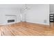 Bright living room featuring a sleek fireplace, hardwood floors, and lots of natural light at 105 Pelican Ct, Mooresville, NC 28117