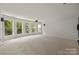Basement features carpeting, recessed lighting, and many windows at 10508 Kristens Mare Dr, Charlotte, NC 28277