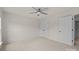 Carpeted bedroom with ceiling fan and walk-in closet at 10508 Kristens Mare Dr, Charlotte, NC 28277