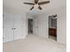 Large bedroom showing open doorways to the Primary closet and bathroom, and featuring neutral carpet at 10508 Kristens Mare Dr, Charlotte, NC 28277