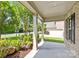 Covered front porch with brick facade and landscaping at 10508 Kristens Mare Dr, Charlotte, NC 28277