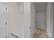 Hallway with coat rack, bench, and storage, offering convenience and organization at 10508 Kristens Mare Dr, Charlotte, NC 28277