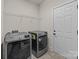 Laundry room with modern appliances and a neutral color palette at 10508 Kristens Mare Dr, Charlotte, NC 28277