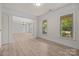 Spacious living room with hardwood floors, bright windows and decorative trim at 10508 Kristens Mare Dr, Charlotte, NC 28277