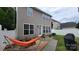 Inviting backyard featuring a hammock, firepit, and outdoor seating at 10732 Trolley Run Dr, Cornelius, NC 28031