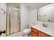 Bathroom featuring a sink, toilet and a glass enclosed shower with brushed gold finishes throughout the space at 10732 Trolley Run Dr, Cornelius, NC 28031