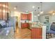 Kitchen showcasing cherry cabinets, granite countertops, and stainless steel appliances at 10732 Trolley Run Dr, Cornelius, NC 28031