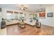 Open-concept living room with hardwood floors and a view of the kitchen at 10732 Trolley Run Dr, Cornelius, NC 28031