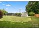 View of expansive green backyard featuring a detached white one car garage at 1155 Melrose Dr, Rock Hill, SC 29732