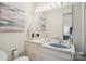 Cozy bathroom featuring a classic vanity with a blue sink and neutral accents at 1155 Melrose Dr, Rock Hill, SC 29732