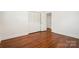 Spacious bedroom featuring hardwood floors, a closet, and neutral walls at 1155 Melrose Dr, Rock Hill, SC 29732